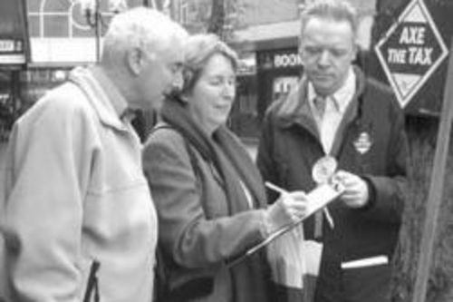 Stephen Robinson collecting signatures for the Axe the Tax campaign