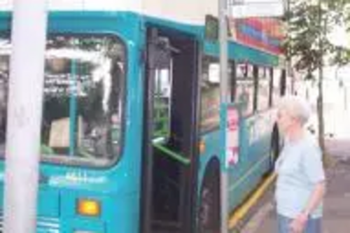 Pensioner at bus stop in Leicester