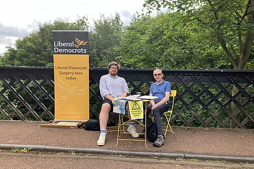 James and Peter sitting at pop-up surgery on Armstrong Bridge