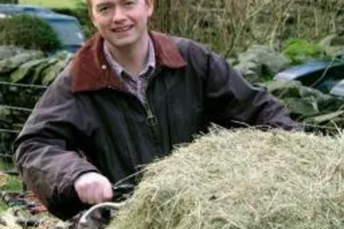 Tim on a quad bike on a hill farm