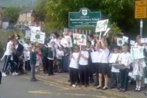 Pupils and parents demonstrate against the closure of Harcourt School