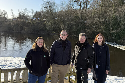 Tom Gordon with Councillor Hannah Gostlow and two employees of the Environment Agency in front of the River Nidd at Knaresborough Lido