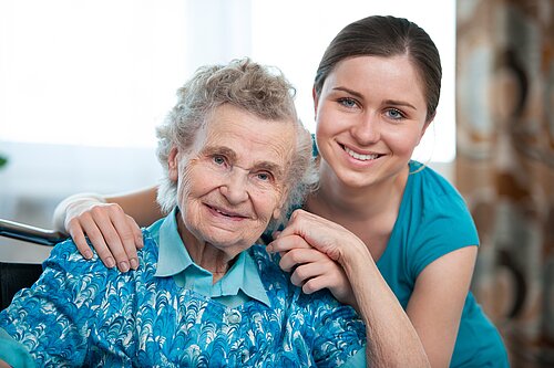 An elderly and her grandaughter.