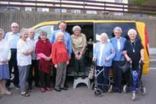 Claire Rayner and Peter Carroll with some of the residents of Holywell House